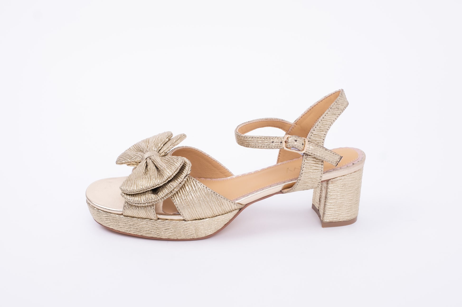 Side view of Rhian Sandal in Gold. A heeled womens shoe with bow detail available in larger sizes. UK 8-12