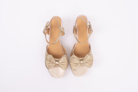 Aerial view of Rhian Sandal in Gold. A scrappy womens heel with bow detail available in larger European sizes 42-46
