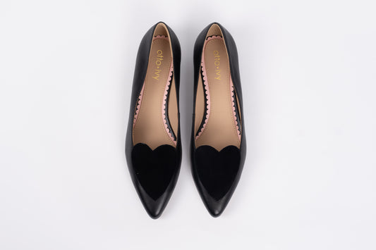 Aerial shot of womens black flat shoe with heart detail available in larger womens UK Sizes 8-12