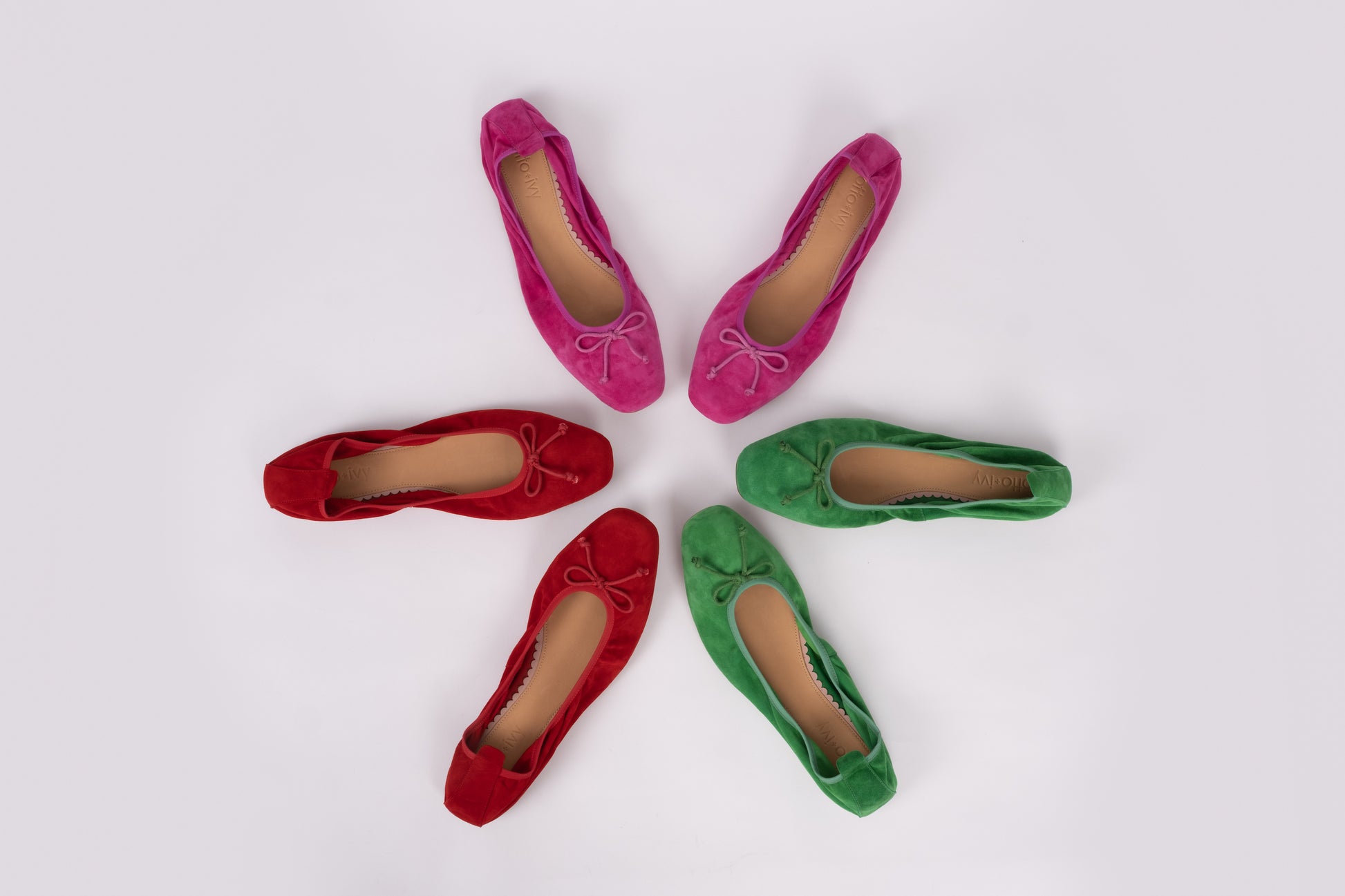 Aerial view of Olivia flats in 3 different colours, red, green and fuchsia. Available in larger sizes for women. European 42-46.