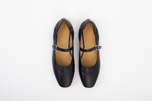 Aerial shot of large sized black leather Mary Jane flat shoe in womens sizes 8 9 10 11 12