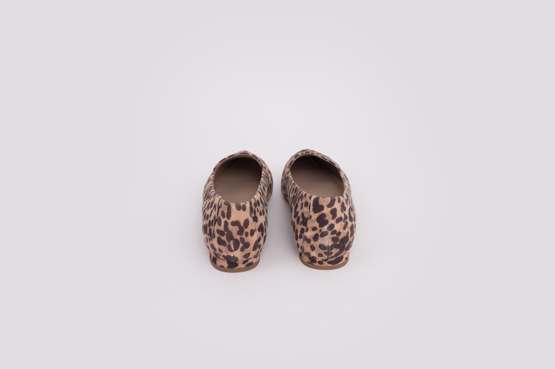 Back view of Ava Flats in leopard print. Available in standard and wide fit, and larger womens sizes 8-12 and 42-46