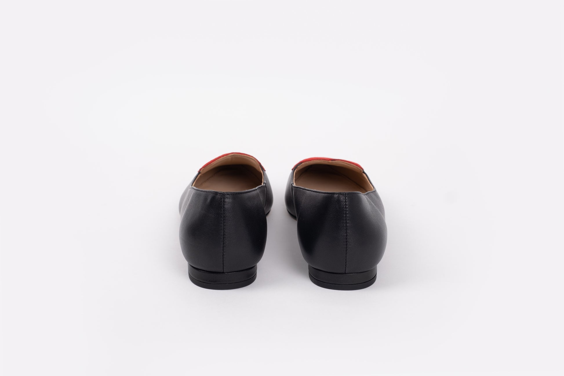 Back view of the Rosie flats in black leather and red suede. Available in larger sizes 42-46