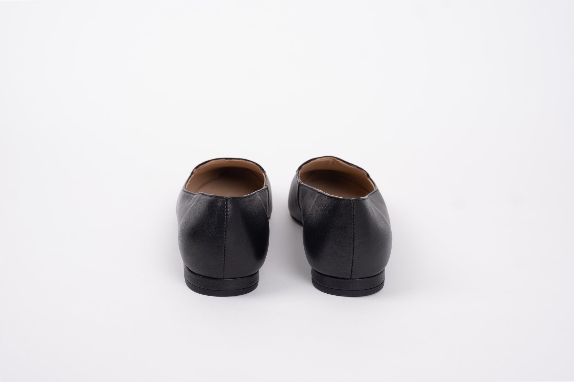 Back view of womens flat shoe in black larger sizes 8-12
