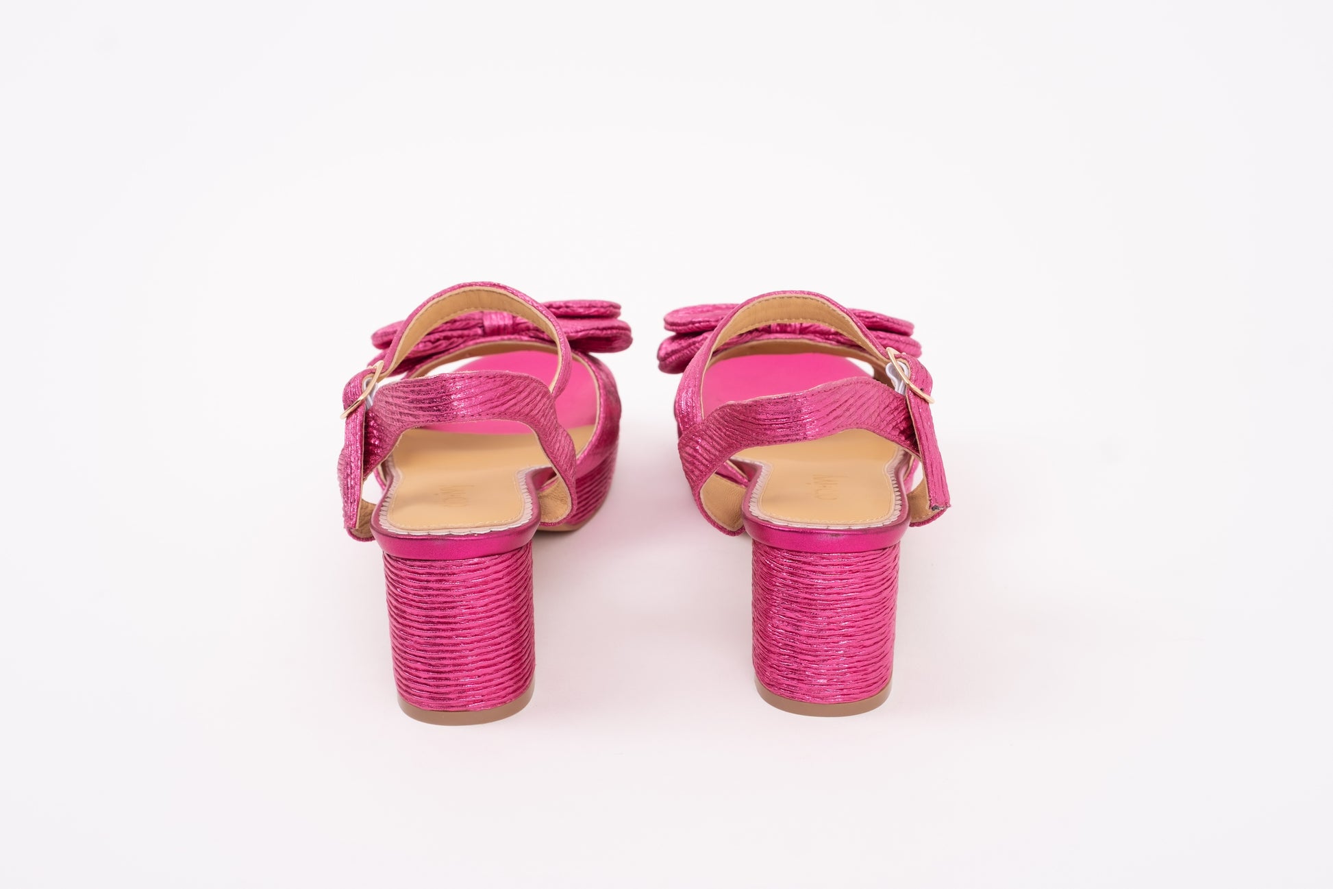 Back view of womens sandal Rhian in Fuchsia Pink. A womens strappy heel with a bow detail. Available in larger womens sizes 42-46