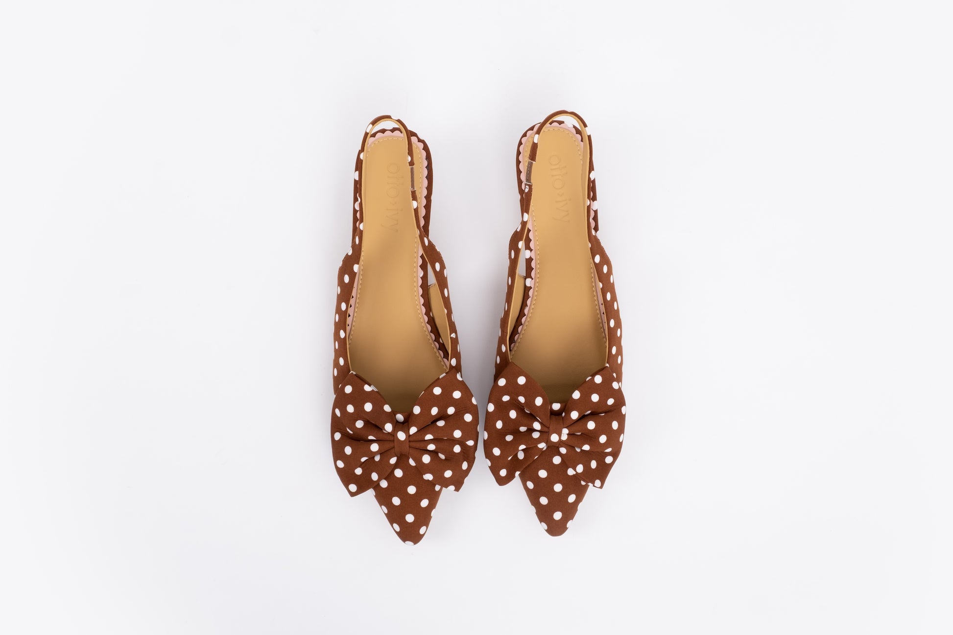Aerial shot of womens bow slingback kitten heels in brown polkadot in larger sizes 42-46