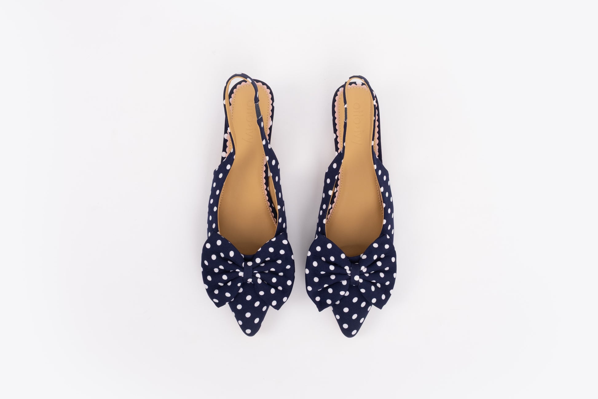 Aerial shot of womens navy polka dot bow slingback kitten teen in larger sizes 8-12