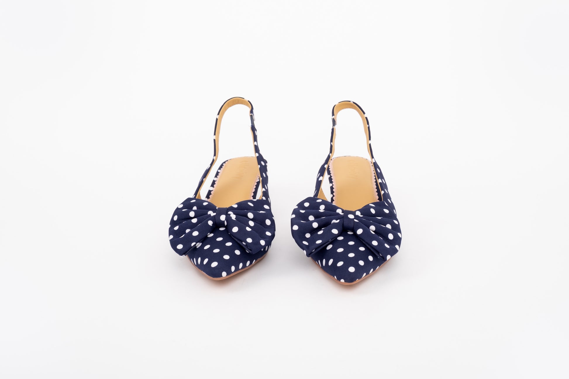 Front shot of navy womens polkadot bow slingback heel available in larger sizes