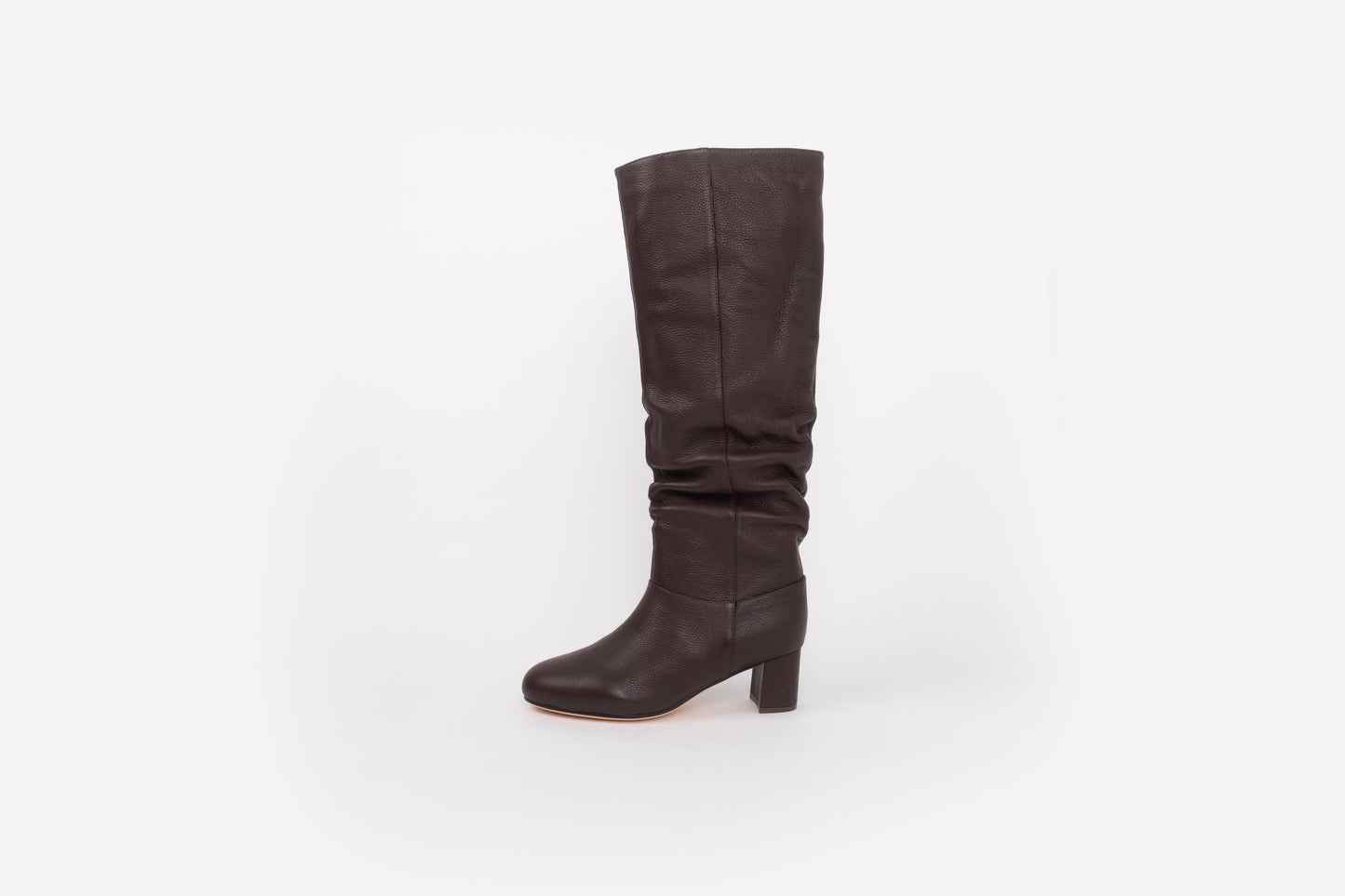 side shot of womens brown leather knee high heeled boot available in larger sizes, stadnard and wide fit.