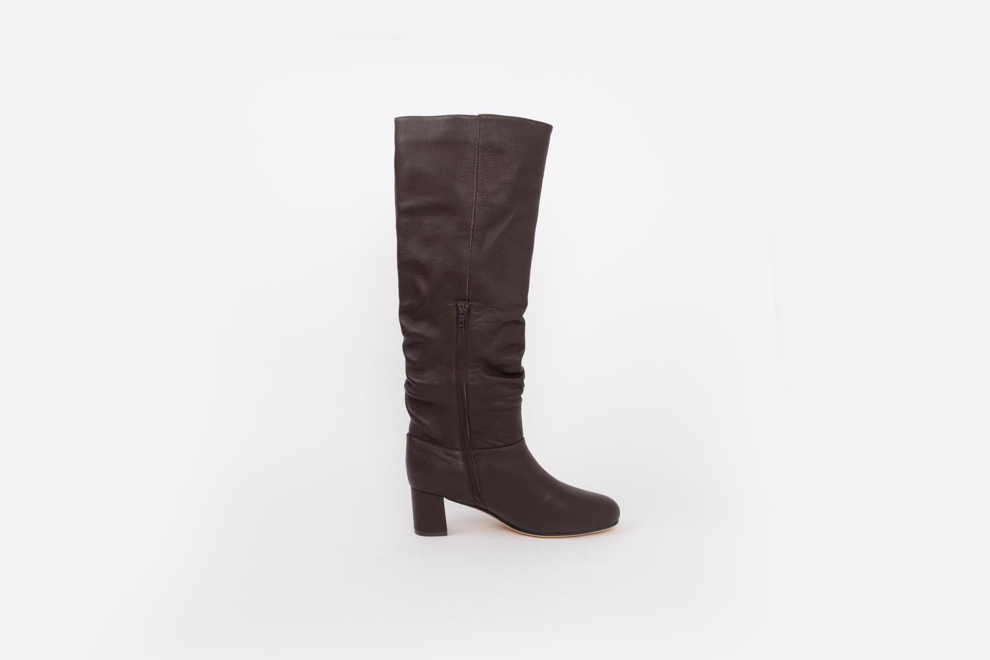 Side shot of large sized womens brown leather knee high boots available in euro sizes 42-46