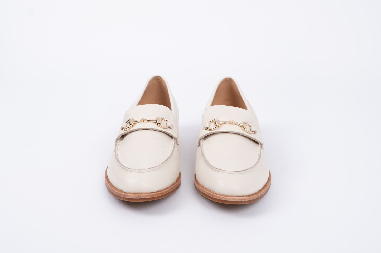 Front view of cream betsy loafers. Womens flat footwear available in European sizes 42-46