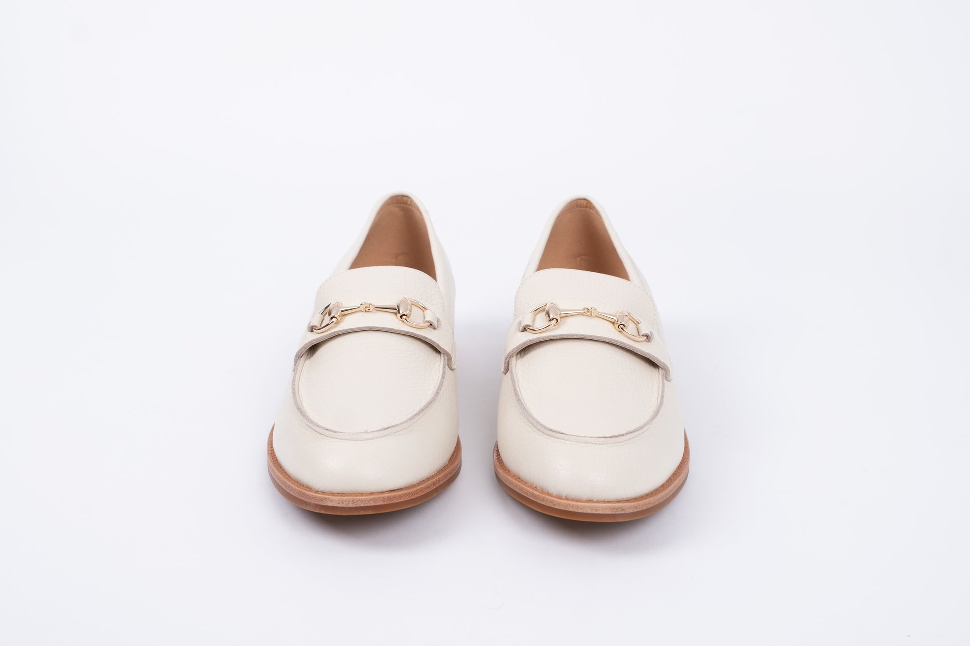 Front view of cream betsy loafers. Womens flat footwear available in European sizes 42-46