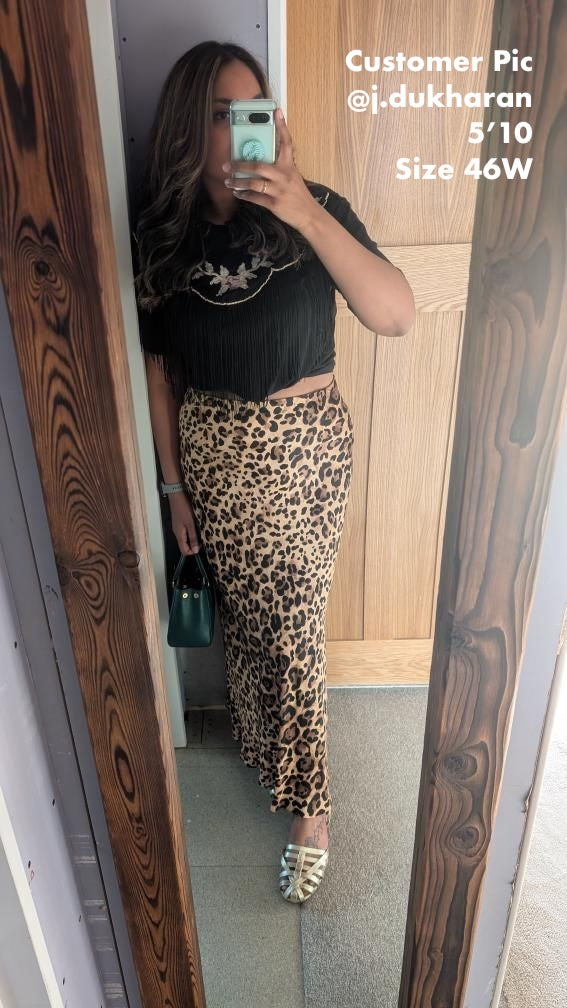 Tall woman wearing size 46w silver sandals