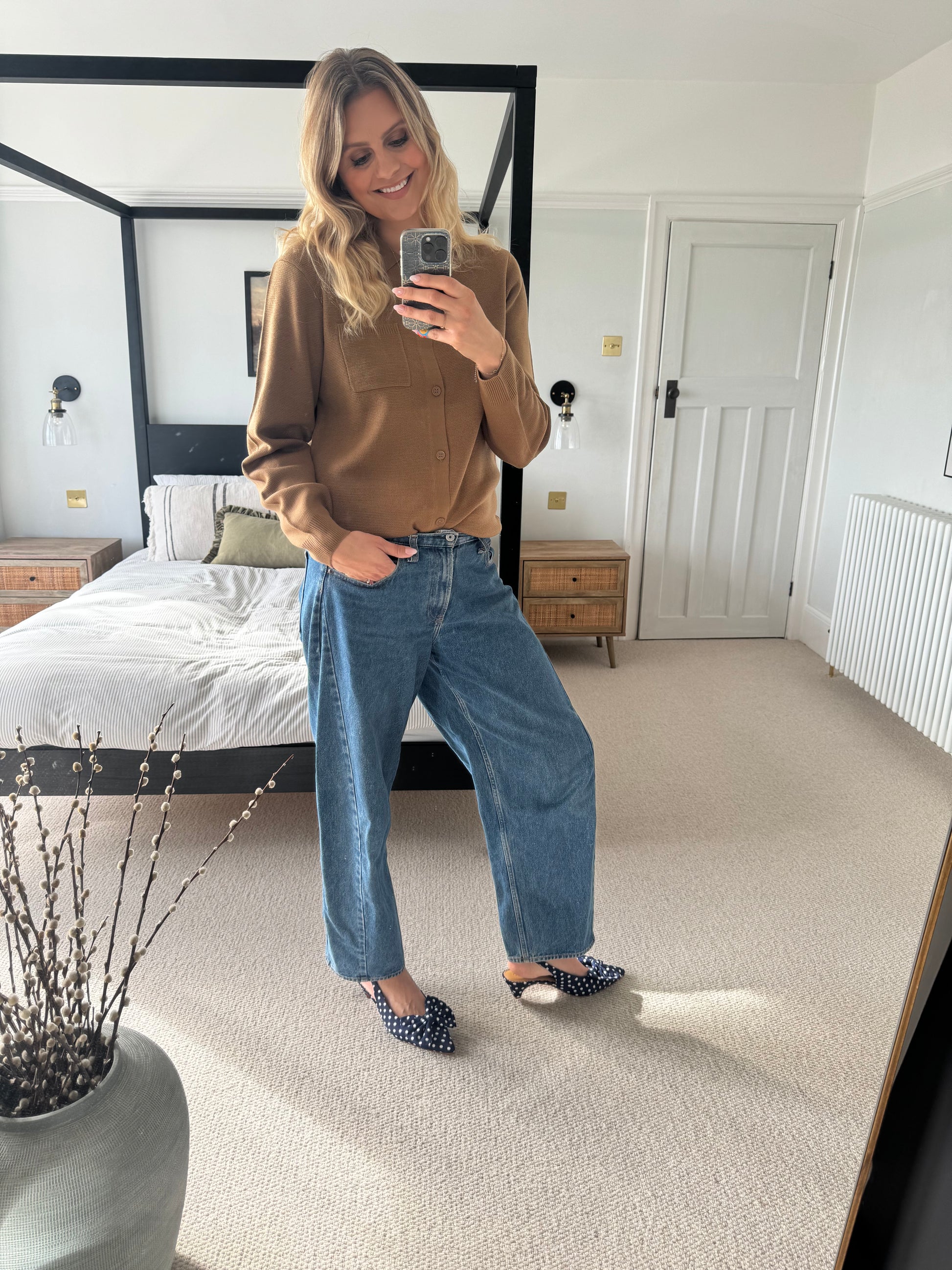 Tall women wearing navy blue polkadot kitten heeled bow slingback in larger sizes 8-12