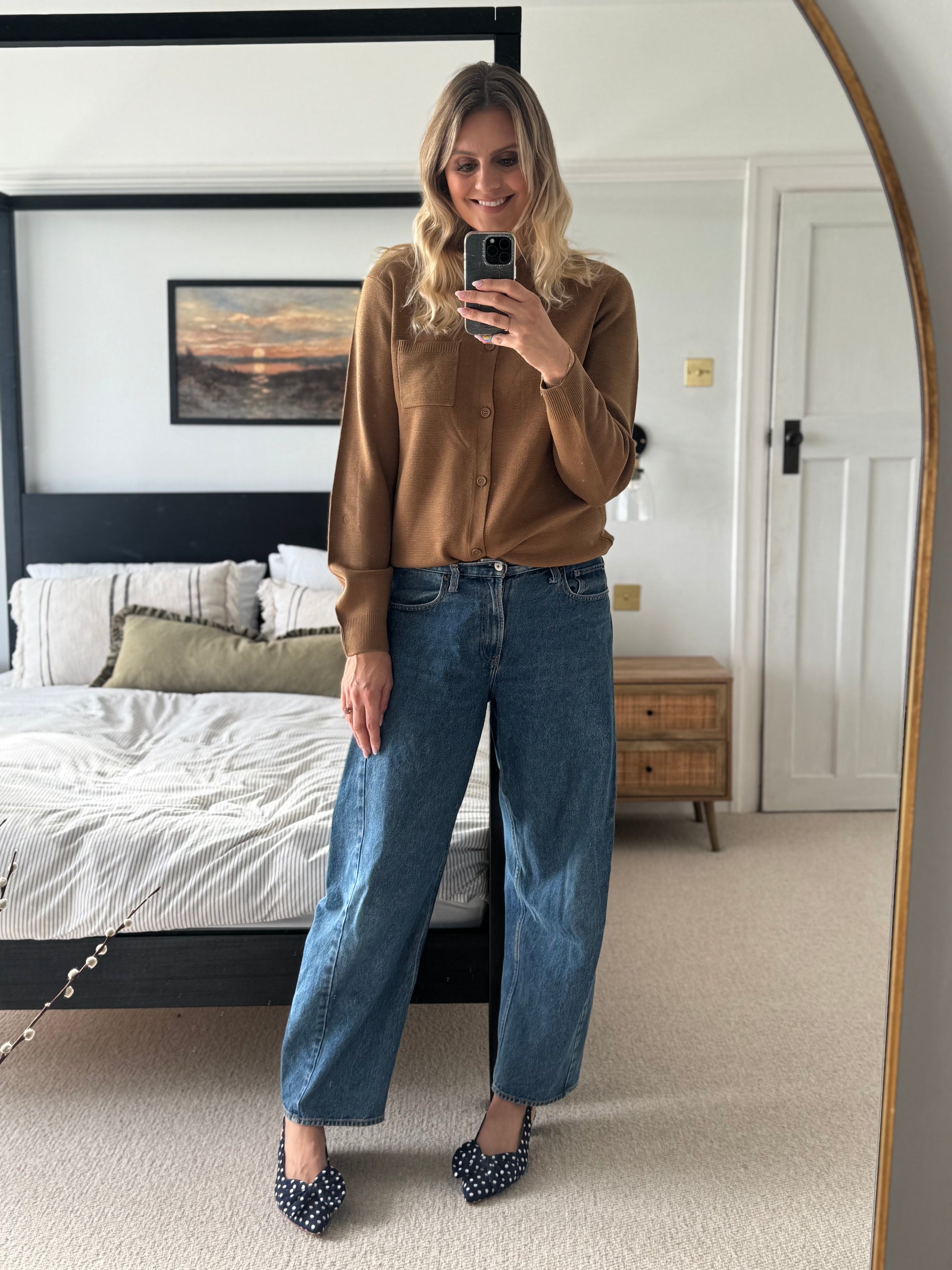 Tall woman wearing navy blue polka bow slingback heels in larger sizes 42-46