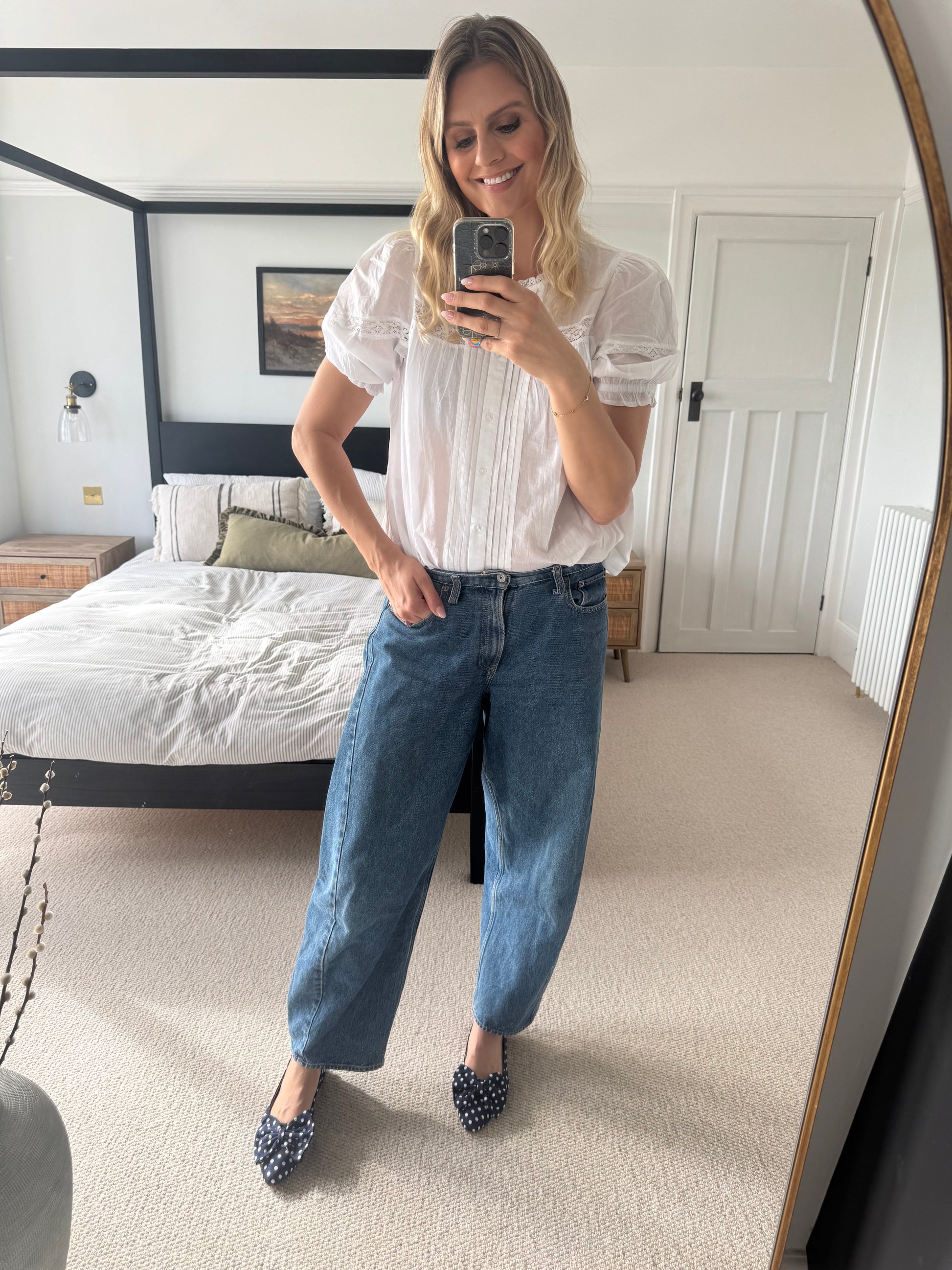 Tall woman wearing large sizes navy polka dot bow flat slingback shoes in large sizes 42-46