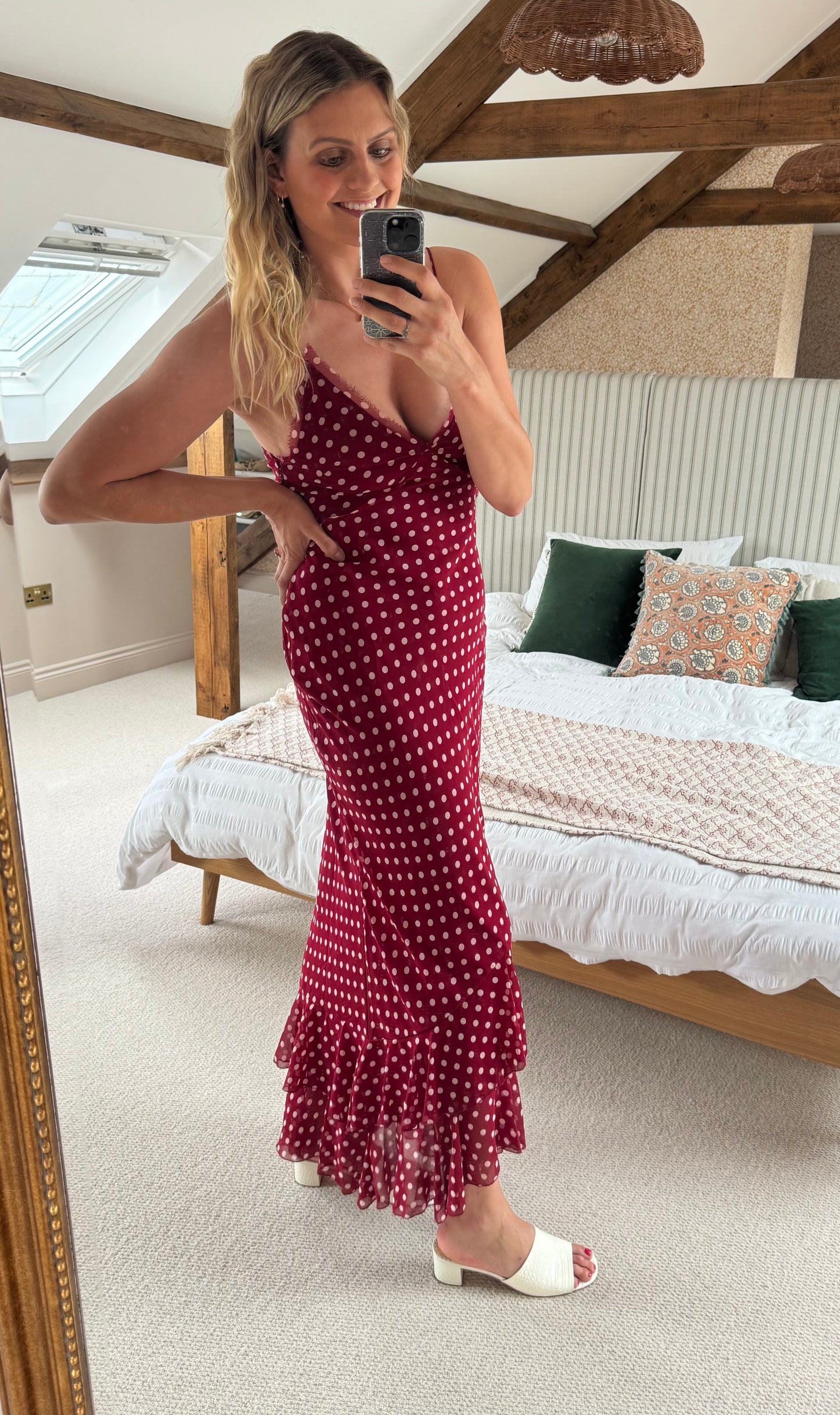 Woman taking a mirror selfie wearing wearing cream sandals in size 8 9 10 11 12