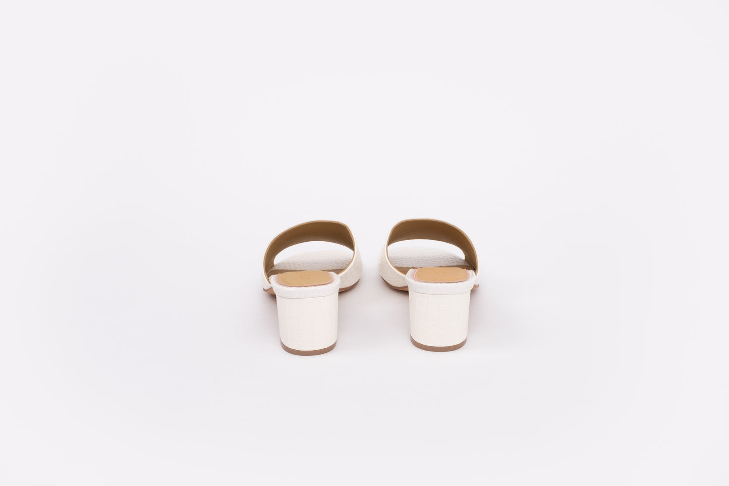Back shot of cream leather heeled sandals available in larger womens sizes 42-46