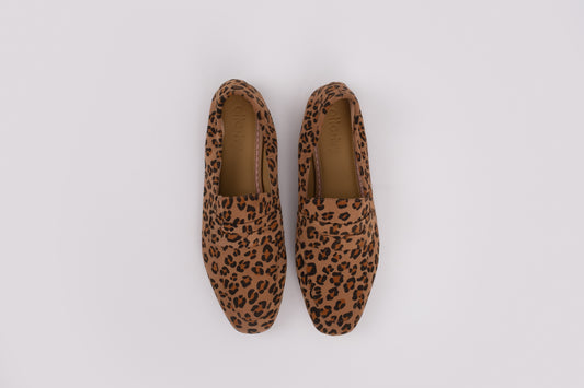 Large sized womens Pair of leopard print loafers on a white background 8-12