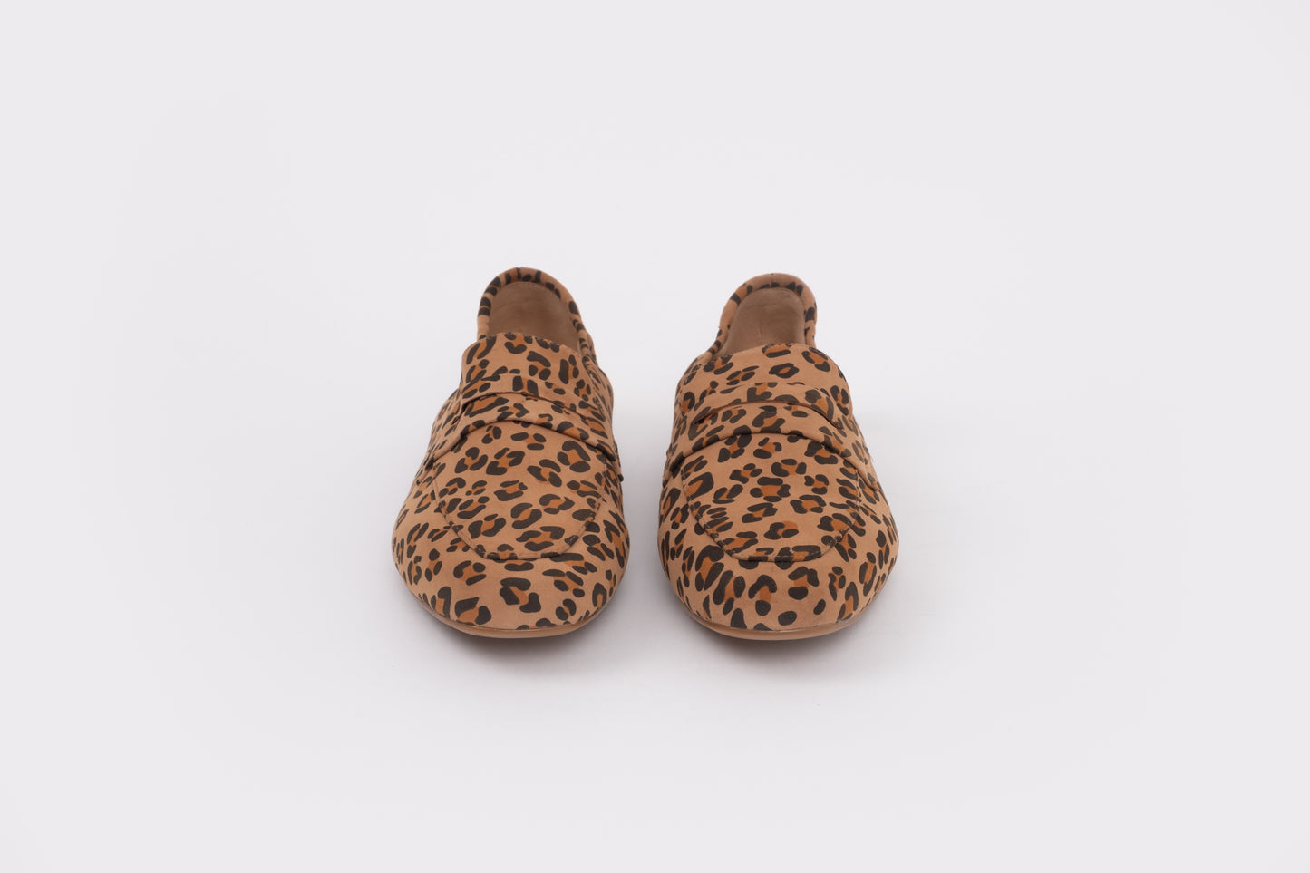 Size 9 womens Pair of leopard print slippers on a white background