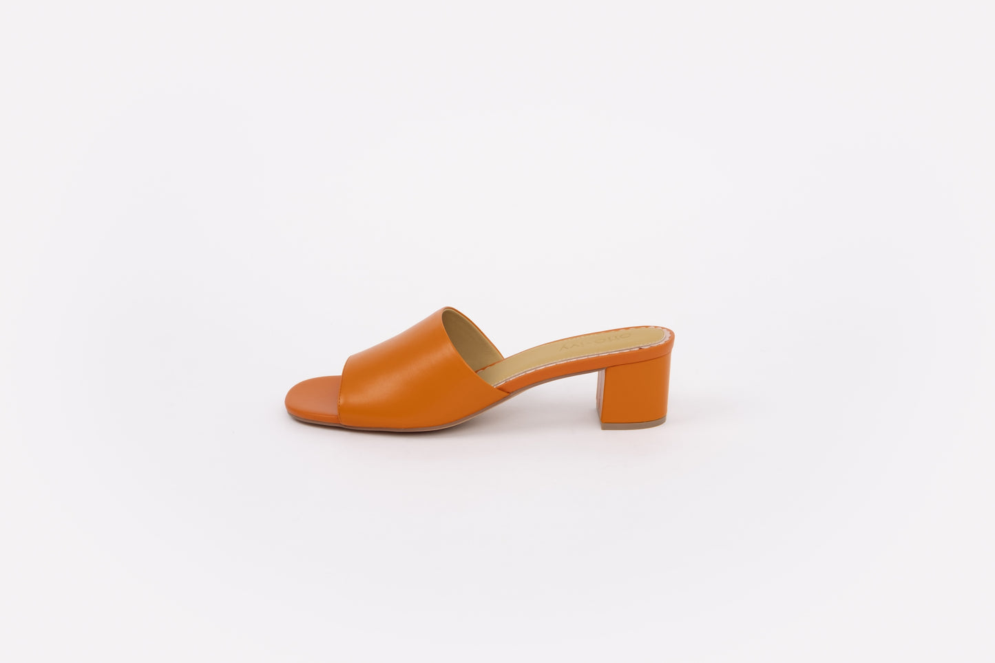 Side shot of womens orange leather heeled slip on shoe in larger sizes