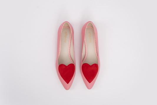 Aerial shot of womens large sized pink and red love heart flat shoes in large sizes 42 43 44 45 46