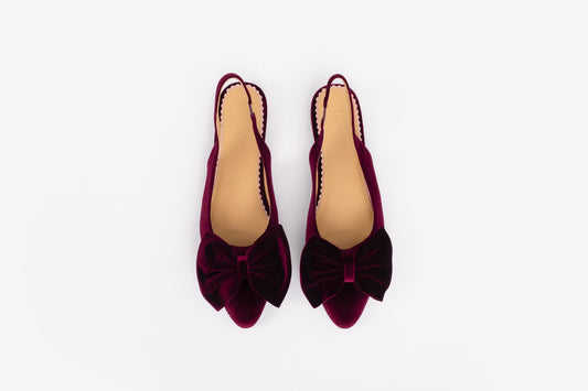 Aerial shot of womens berry velvet bow slingback flat shoe. Available in European sizes 42-46