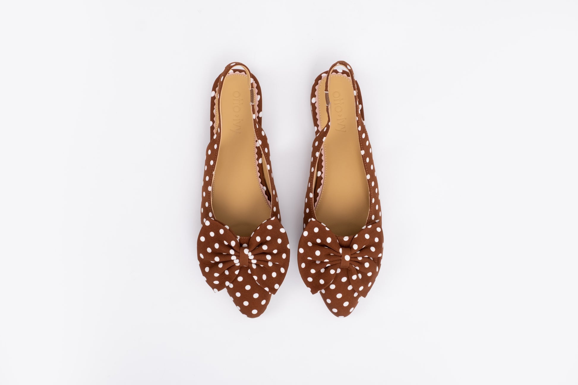 Aerial shot of womens brown polka dot slingback flat bow shoe in larger sizes 42 -46