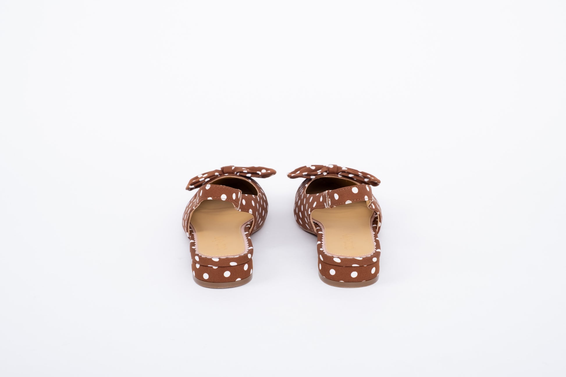 Back shot of womens brown polka dot  bow slingback flat shoe in large sizes 8-12