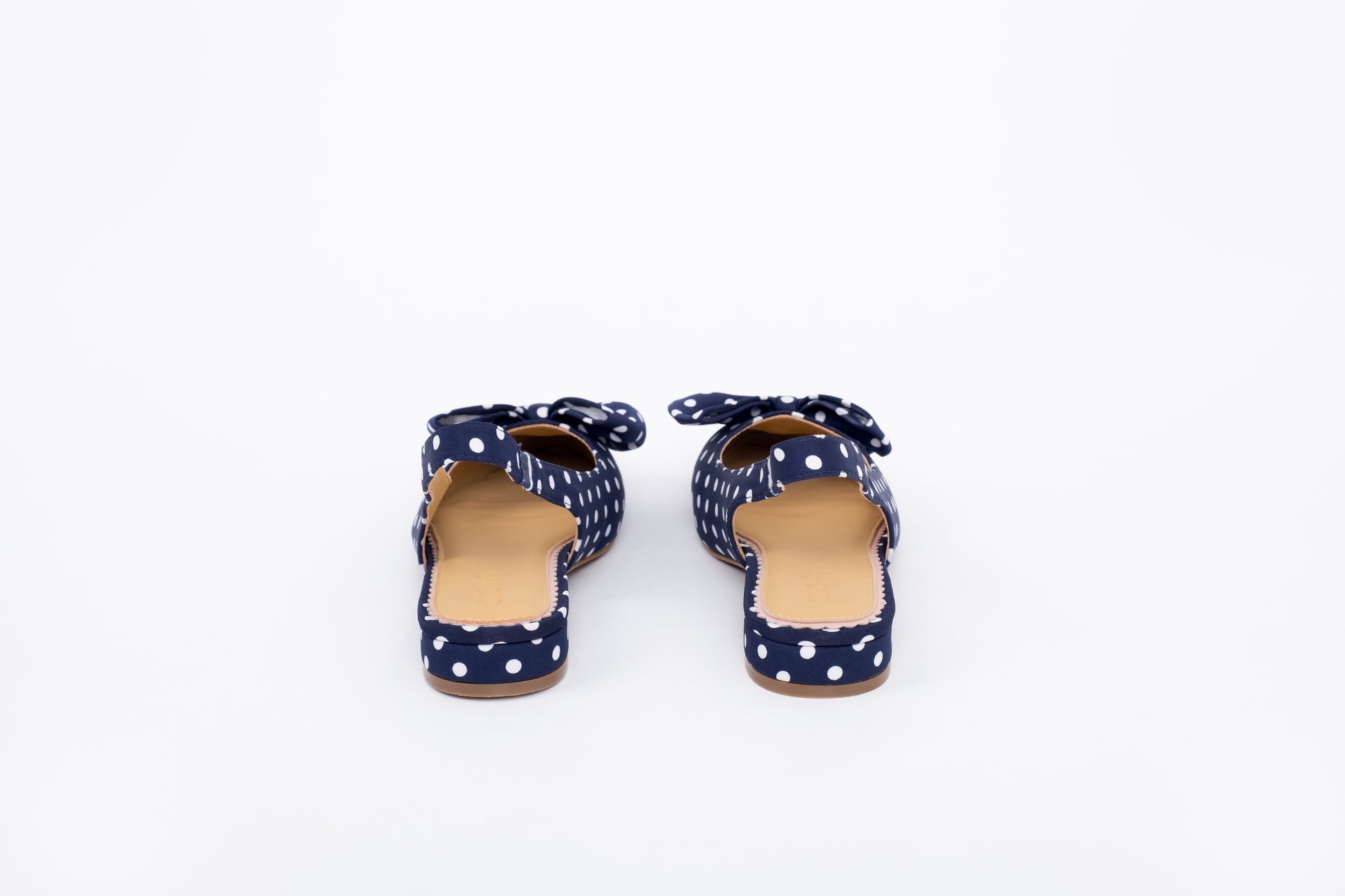 Back shot of womens navy slingback bow flats in larger sizes 8-12