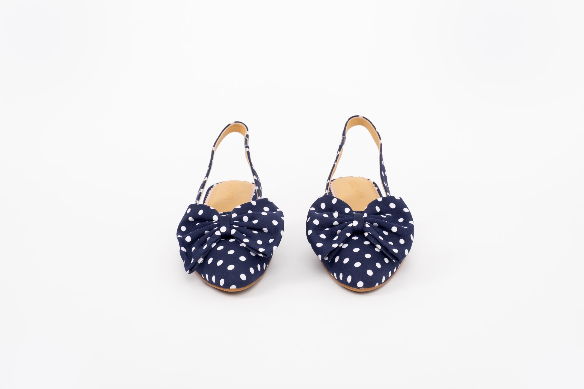 Front shot of bow heeled kitten Delilah in navy polka in European sizes 42-46