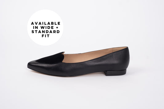 Side profile of womens black flat shoe with heart detail available in euro sizes 42-46