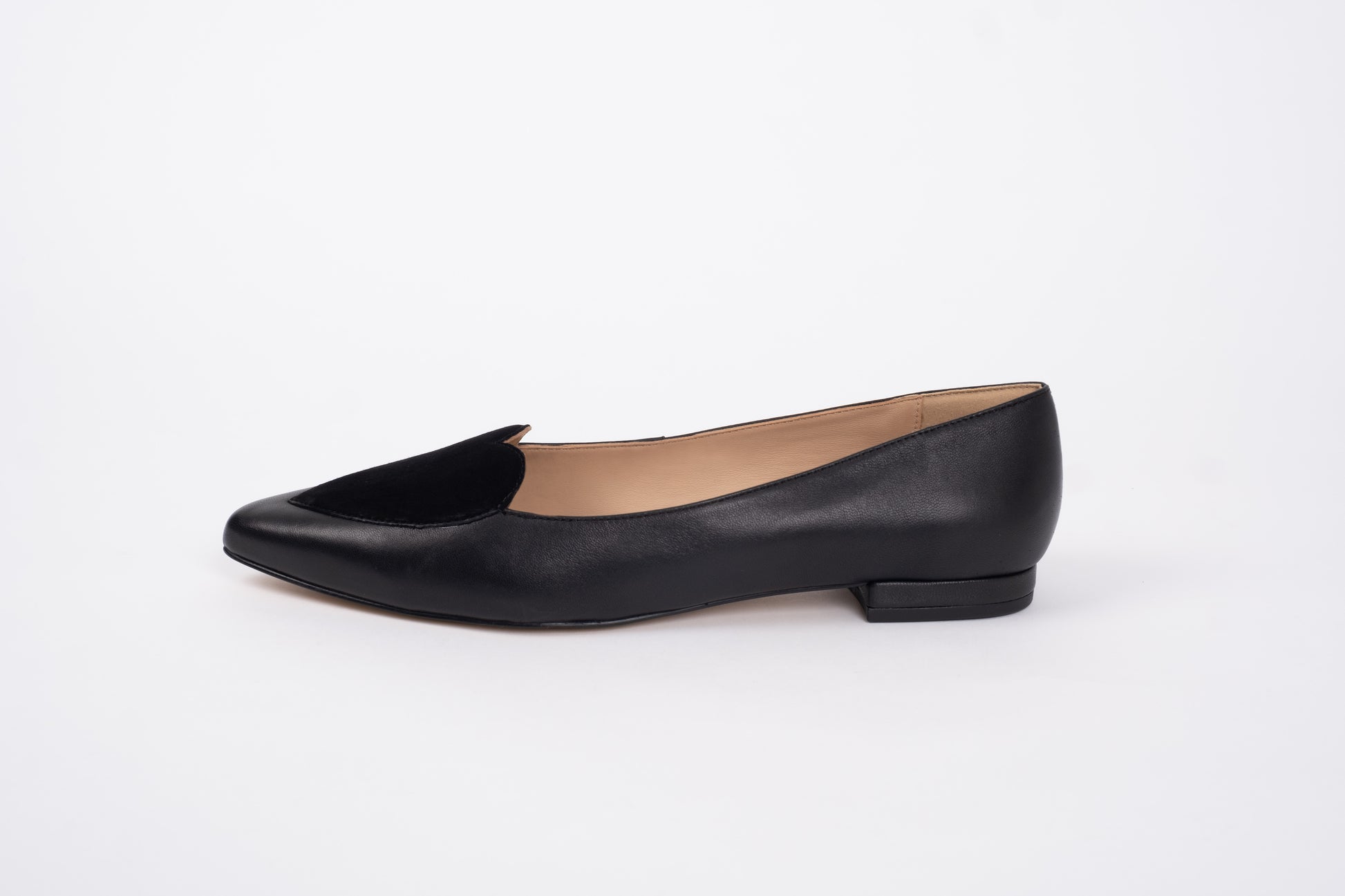 Side profile of womens black leather and suede shoe with heart detail available in larger European sizes 42-46