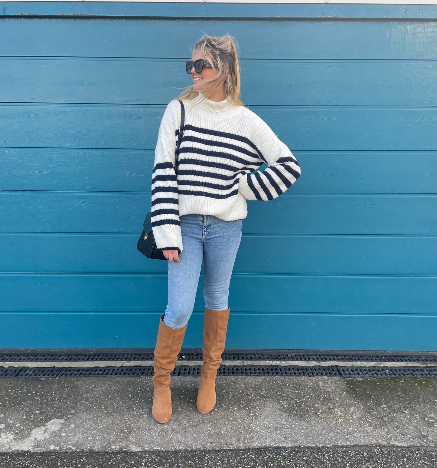 Tall model wearing Evelyn boots available in European sizes 42-46