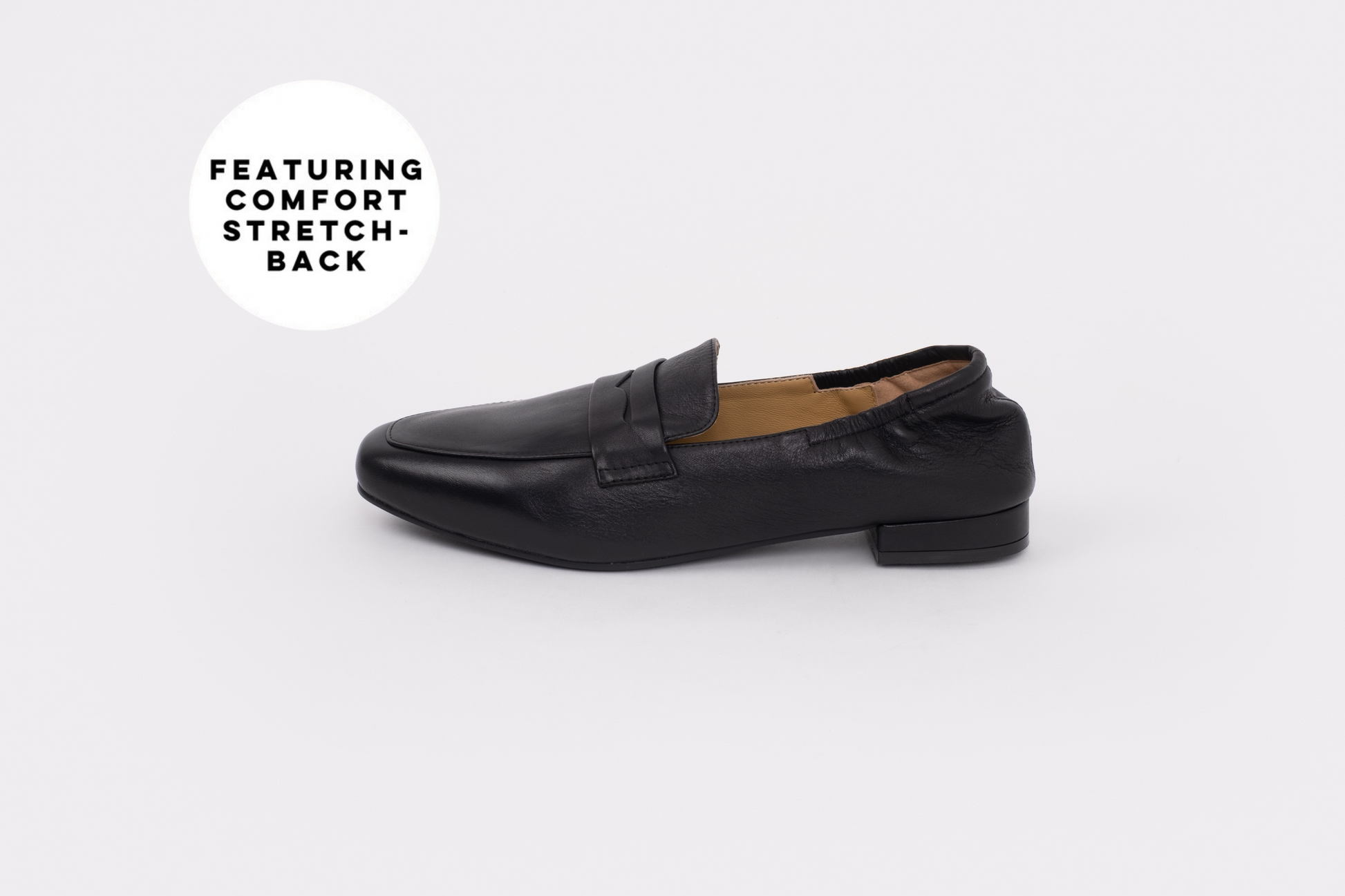 Black loafer shoe on a white background with text 'Featuring Comfort Stretch-Back'.
