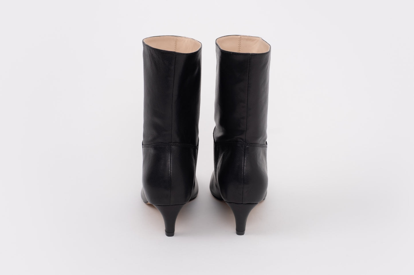 Back shot of womens black leather boot in larger sizes 8-12