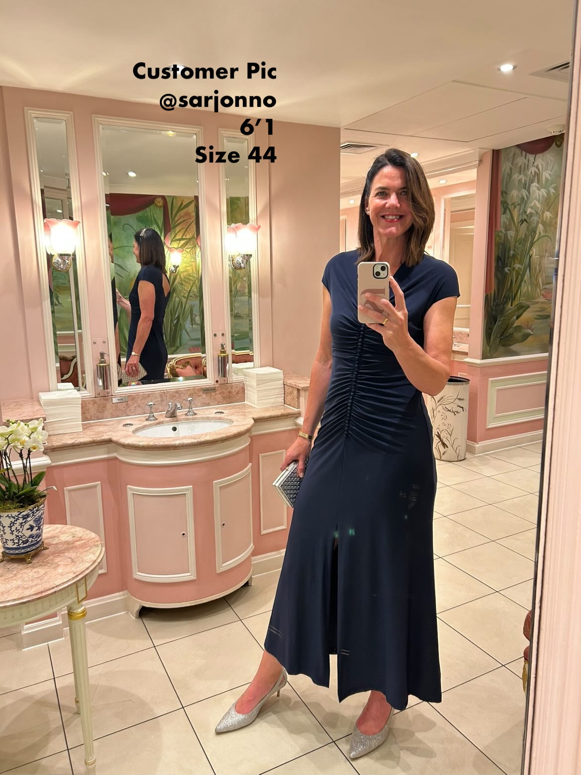 Tall woman wearing large sized silver size 44 shoes