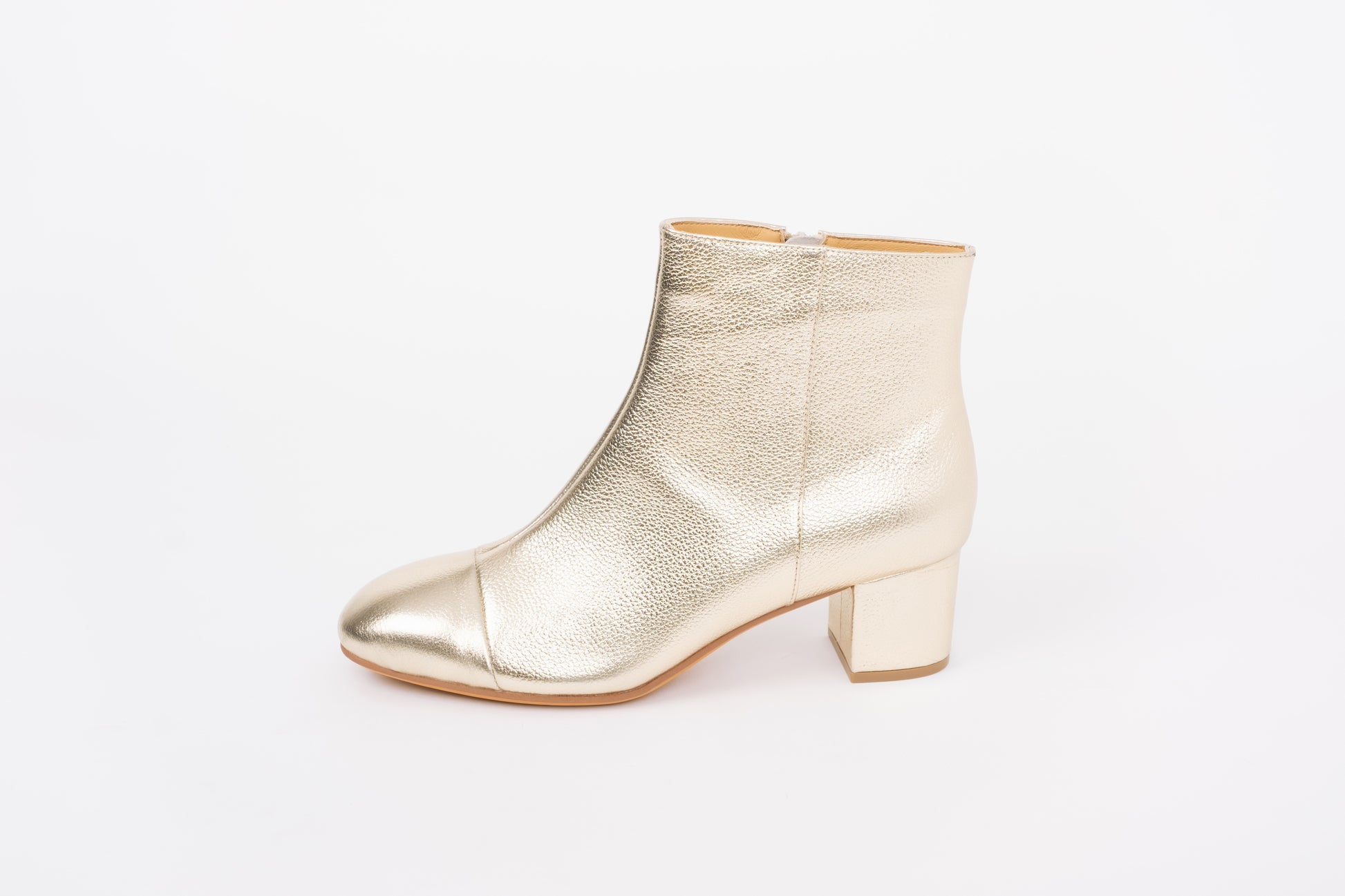 Side view of Izzy boots in gold. Womens ankle boot available in larger sizes 8-12