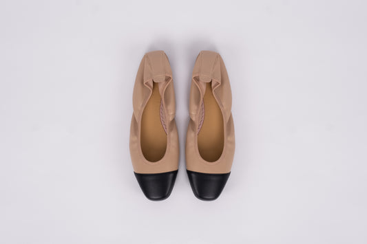 Aerial shot of womens beige and black womens flat shoe available in womens larger sizes euro 42-46