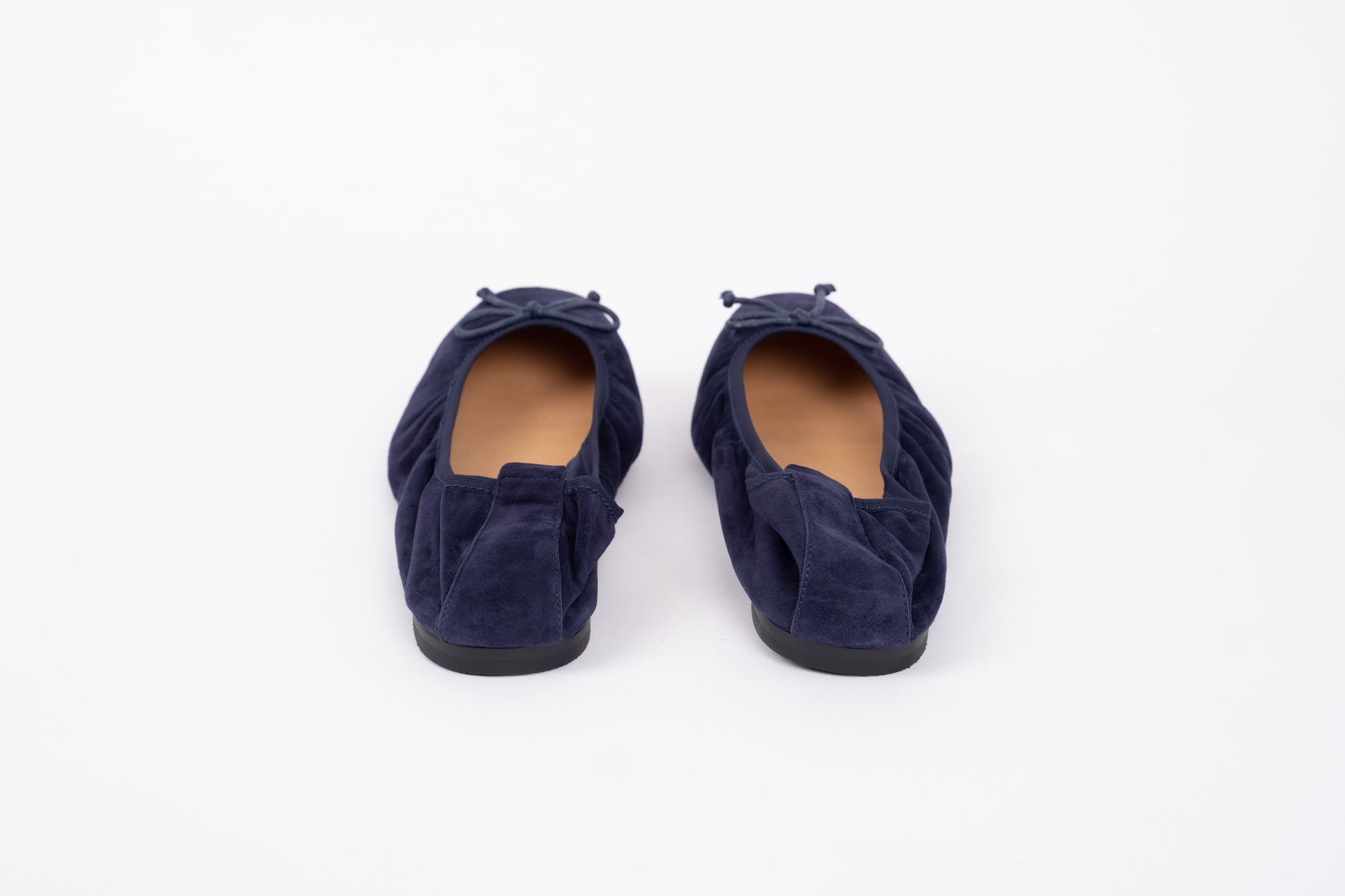 Back view of stretchy flat shoe Olivia in navy suede. Available in womens larger European sizes 42-46