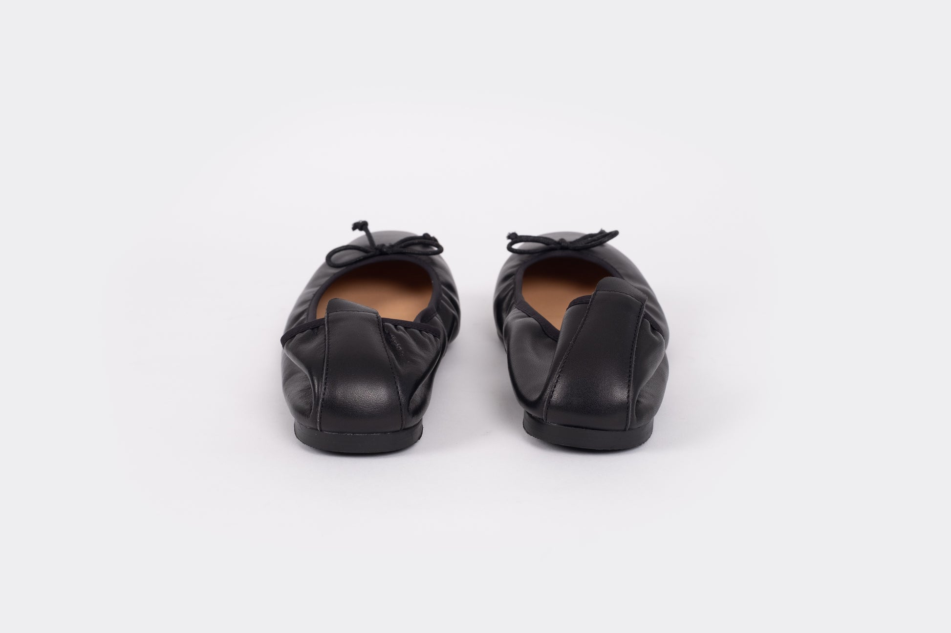 Back view of Olivia Flats in black. An elasticated leather womens flat available in large womens European sizes 42-46