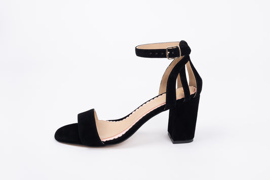 Side profile of Bibi in black. A womens strappy heeled sandal available in larger European sizes 42-46