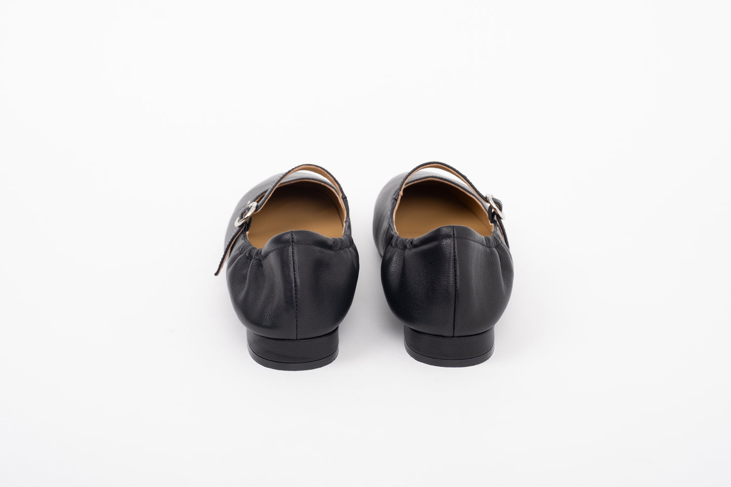 Back shot of womens black leather flat ne strap Mary Jane shoes in sizes 42 43 44 45 46