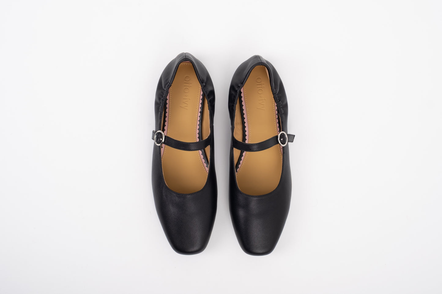 Aerial shot of large sized black leather Mary Jane flat shoe in womens sizes 8 9 10 11 12