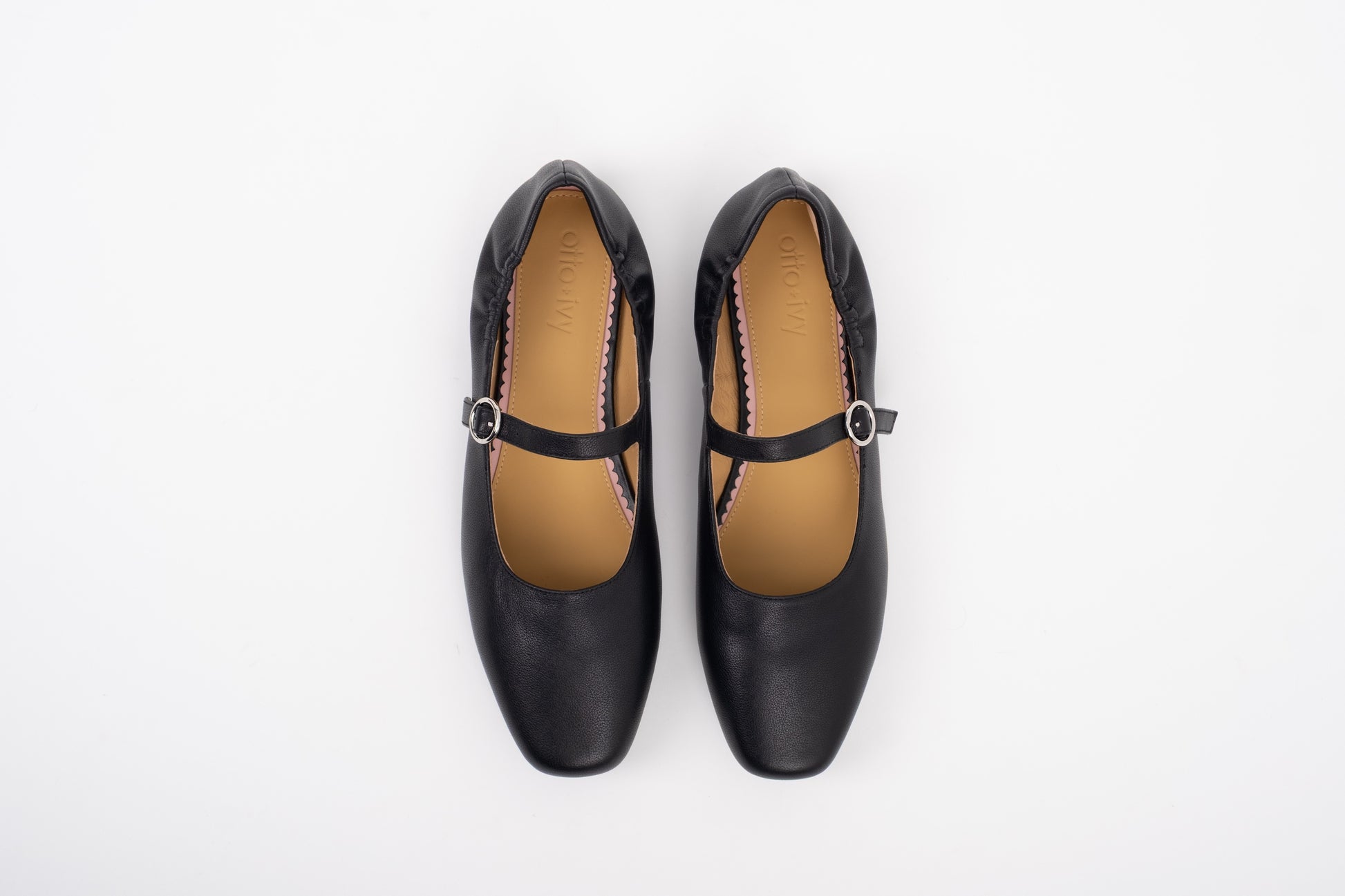 Aerial shot of large sized black leather Mary Jane flat shoe in womens sizes 8 9 10 11 12