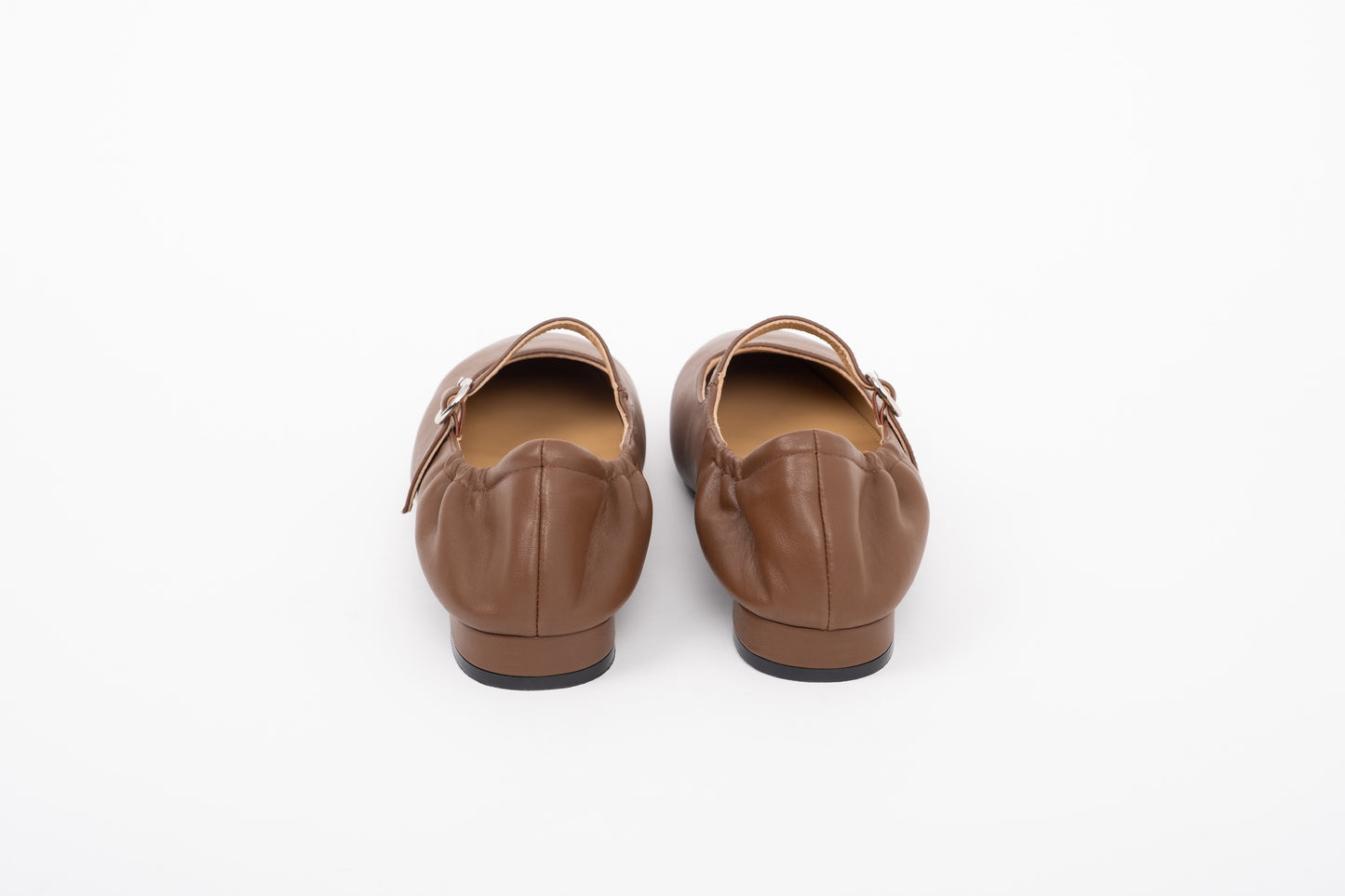 Back shot of leather brown womens large sized flat Mary Jane shoes in sizes 8 9 10 11 12