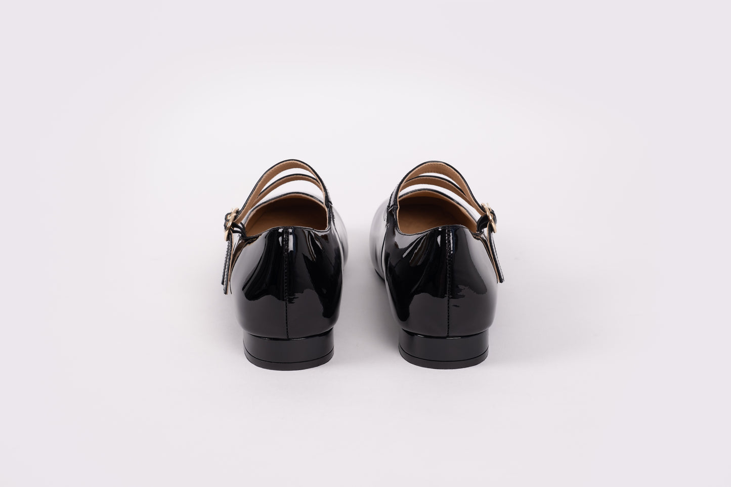 Back view of Jemima Flat in black. A womens 2 strap Mary Jane shoe available in womens larger UK sizes 8-12