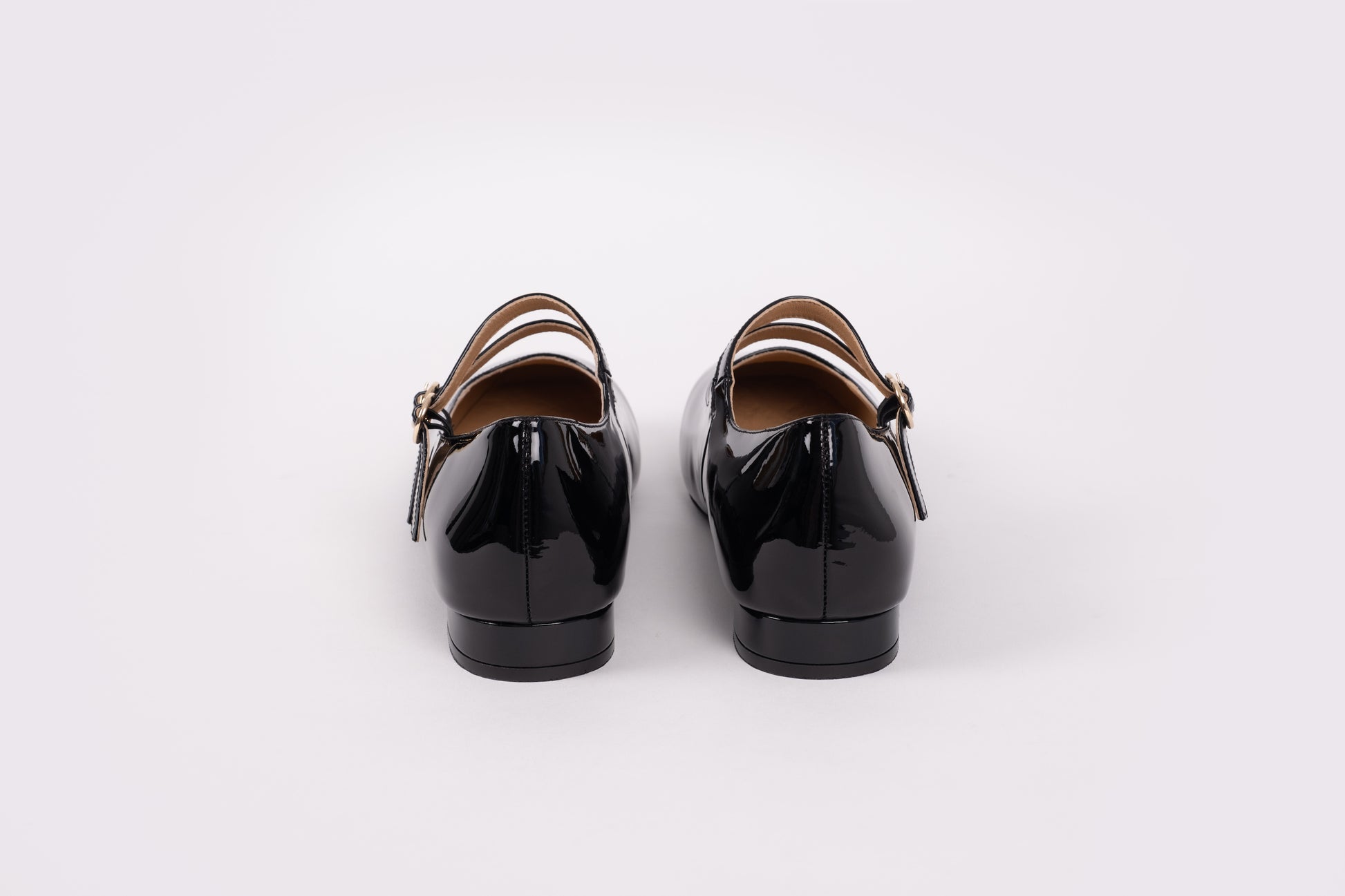 Back view of Jemima Flat in black. A womens 2 strap Mary Jane shoe available in womens larger UK sizes 8-12