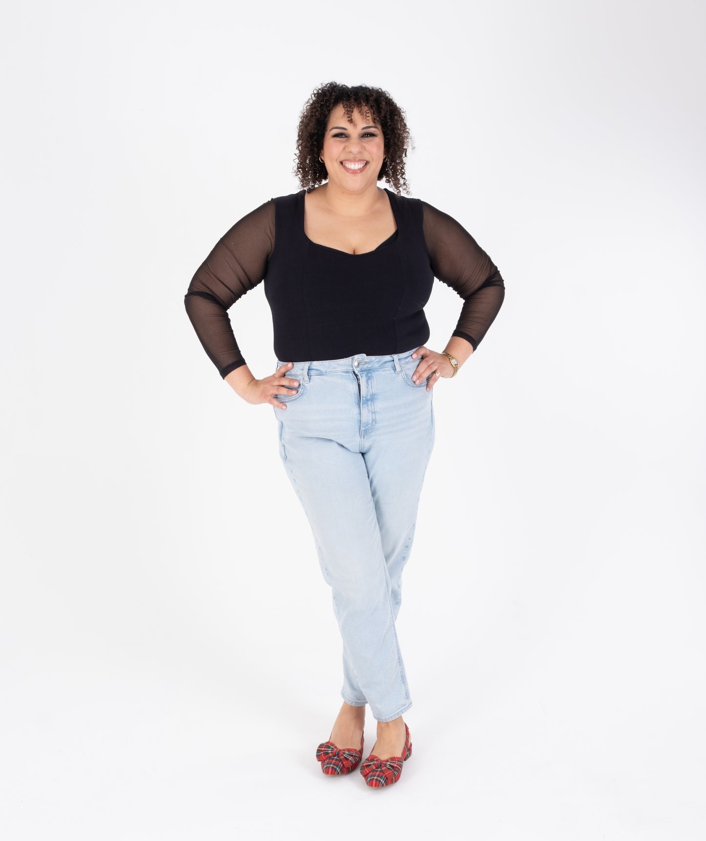 Tall woman modelling tartan bow slingback flat shoes in larger sizes 42 43 44 45 46