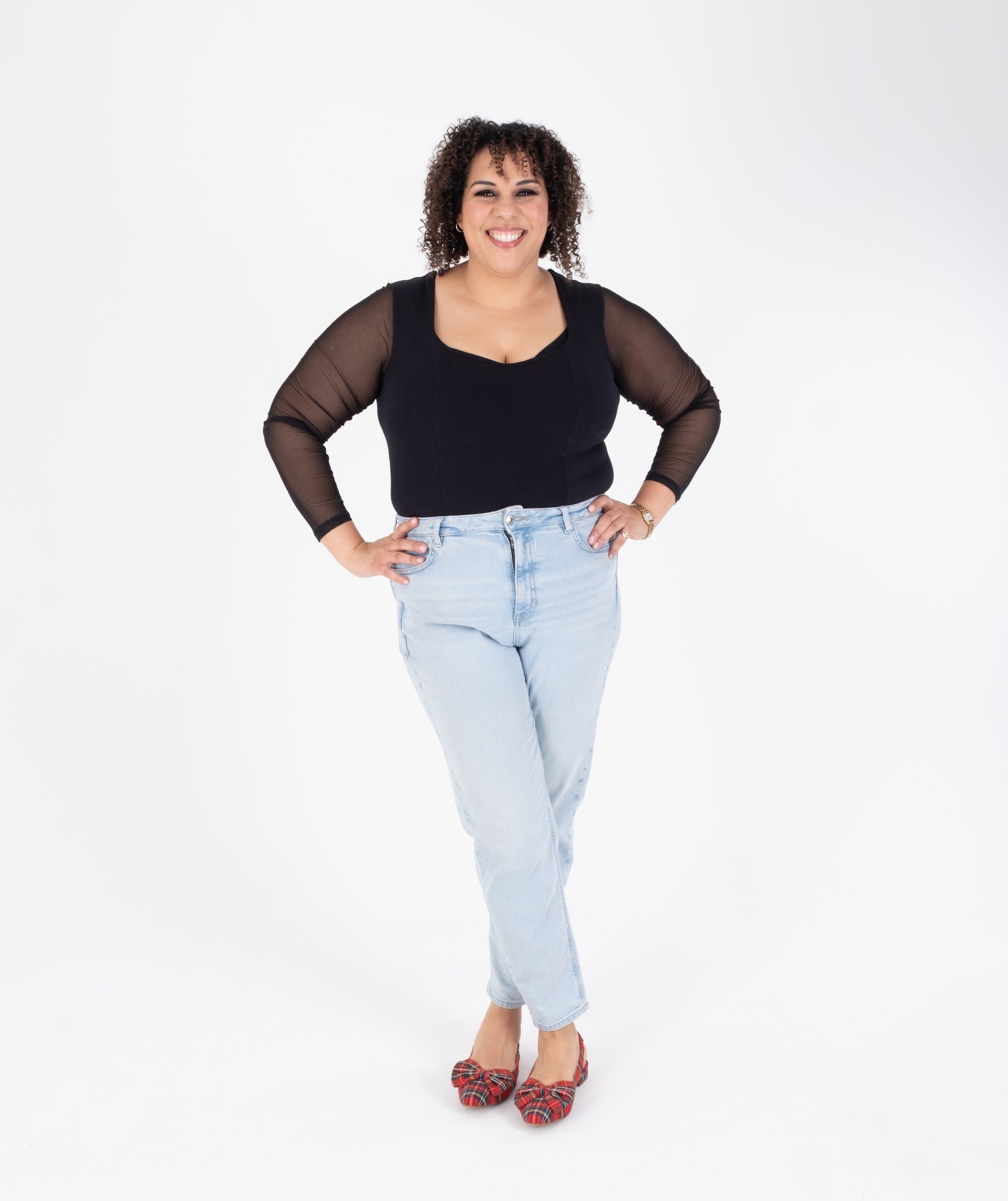 Tall woman modelling tartan bow slingback flat shoes in larger sizes 42 43 44 45 46